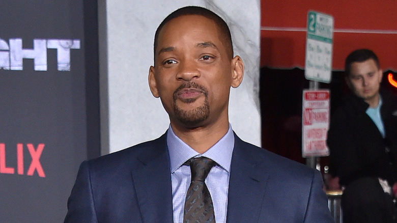 Will Smith looking serious on the red carpet