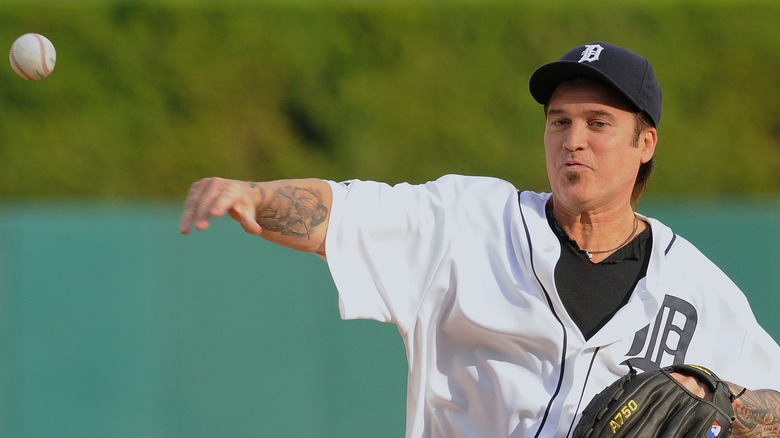 Billy Ray Cyrus throwing baseball