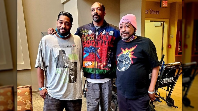 Bing Worthington stands with Snoop Dog in studio