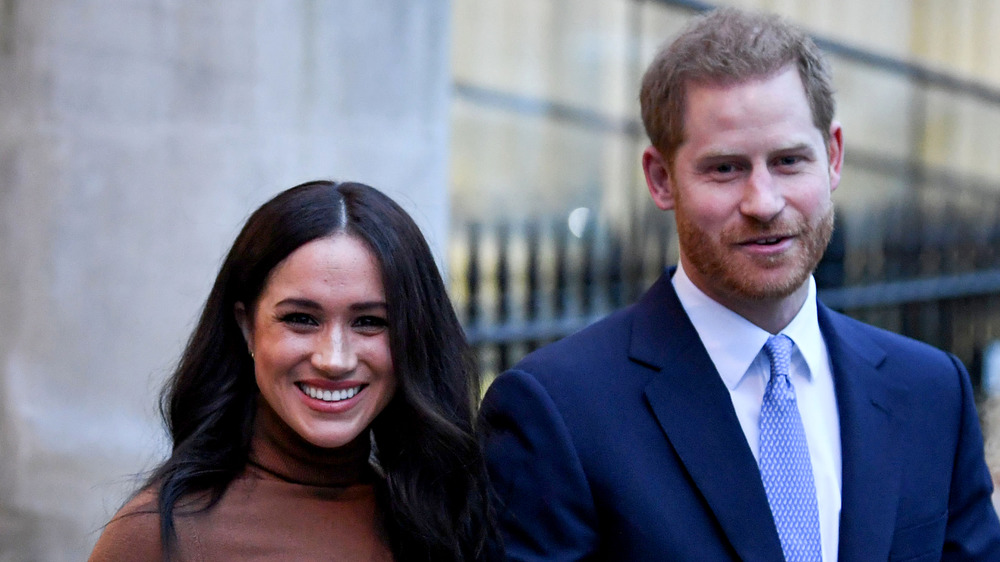 Prince Harry and Meghan Markle smiling