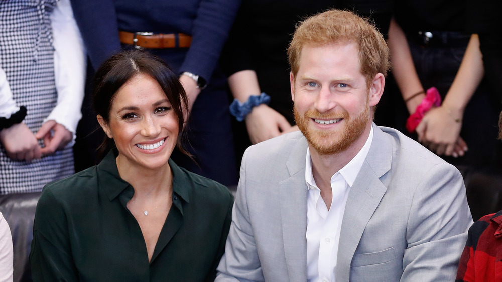 Prince Harry and Meghan Markle smiling