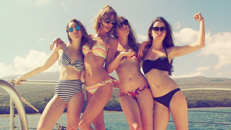 Taylor Swift and Haim sisters posing in bikinis