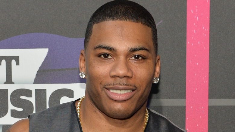 Nelly smiling at an event