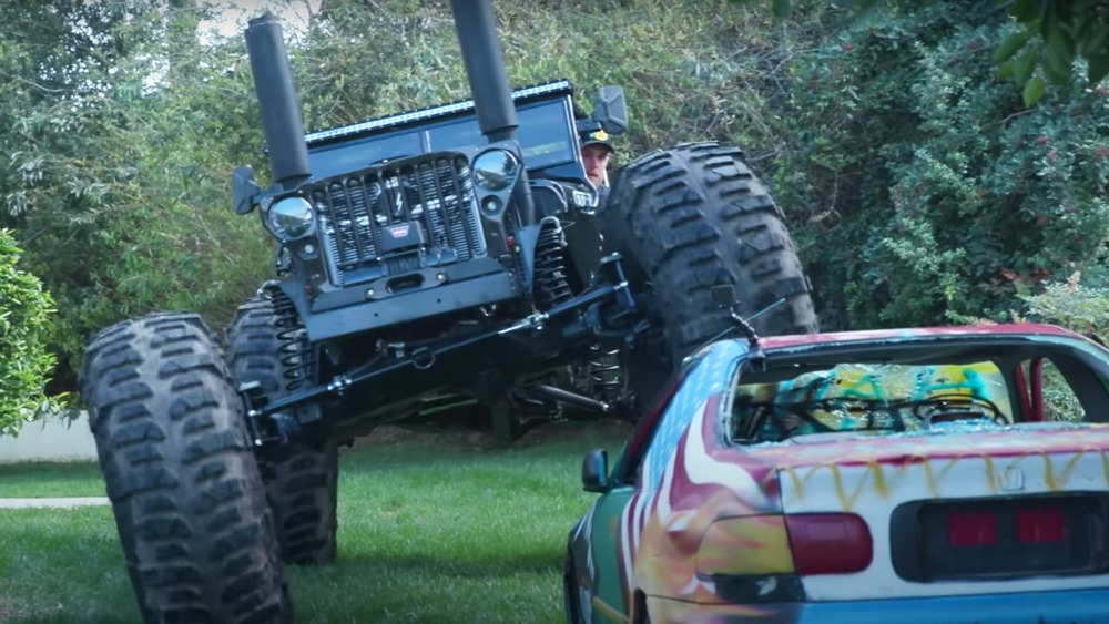 Jake Paul crushing a car with his apocalypse vehicle 