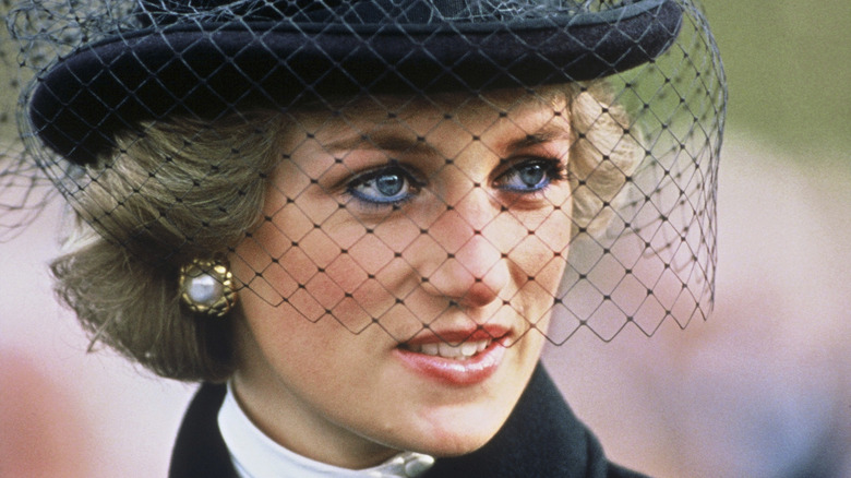 Princess Diana wearing black hat