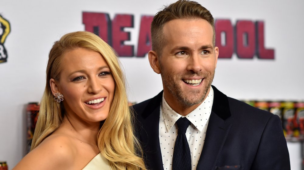 Actors Blake Lively (L) and Ryan Reynolds attend the "Deadpool" fan event 