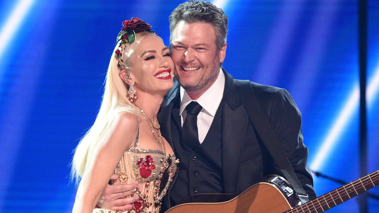 Gwen Stefani and Blake Shelton pose onstage during the 62nd Annual GRAMMY Awards