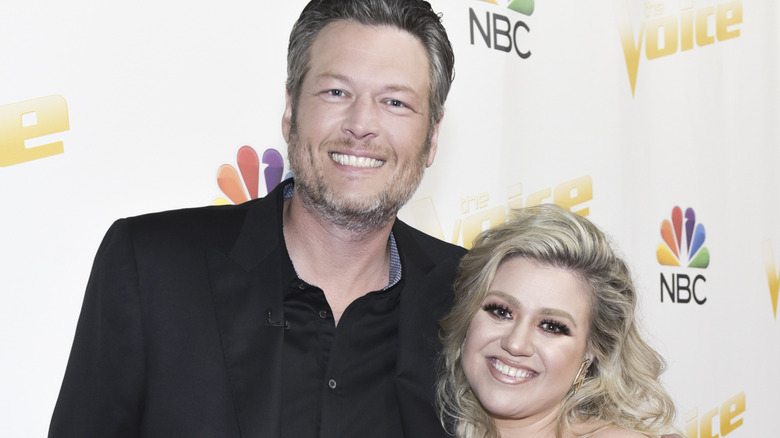 Singers/coaches Blake Shelton (L) and Kelly Clarkson attend NBC's "The Voice" Season 14 on April 30, 2018