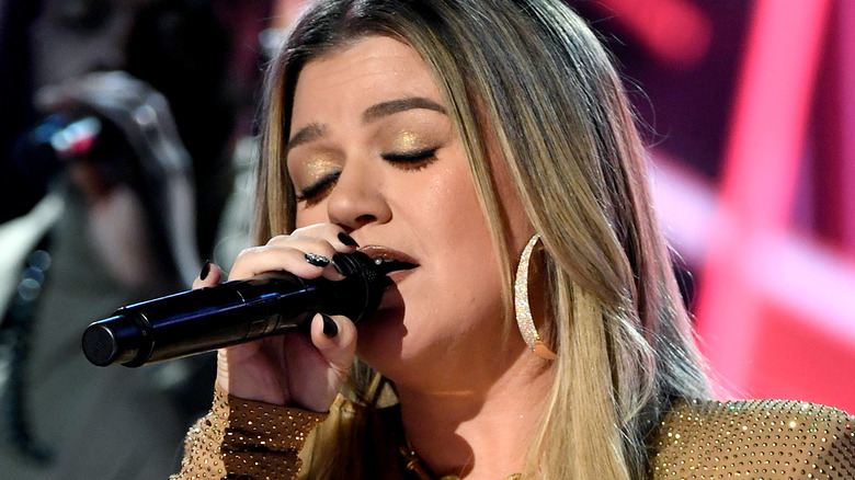 Kelly Clarkson performs on stage