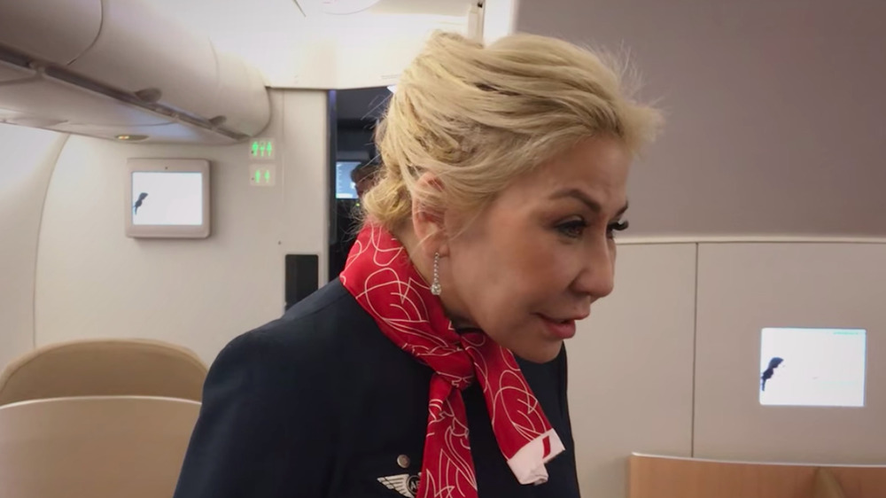 Anna Shay smiling while dressed as a flight attendant