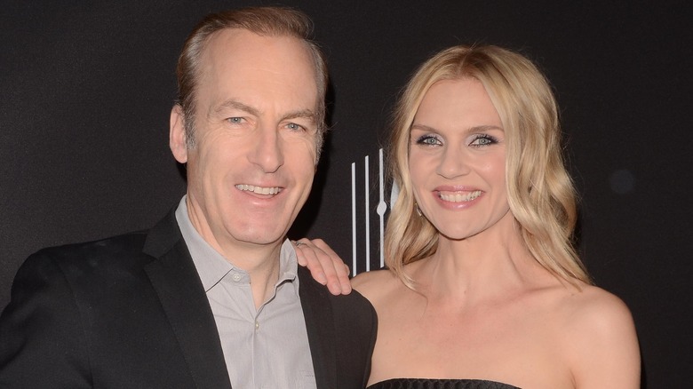 Bob Odenkirk and Rhea Seehorn smiling on the red carpet