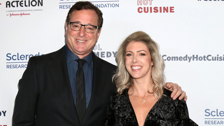 Bob Saget and wife Kelly Rizzo posing in 2019