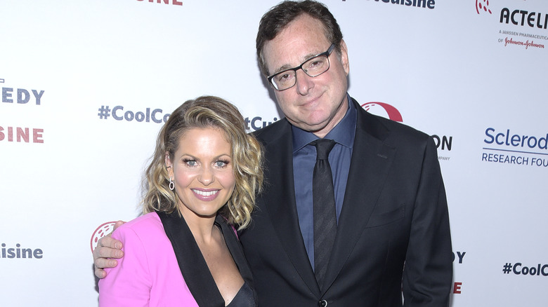 Candace Cameron Bure and Bob Saget posing