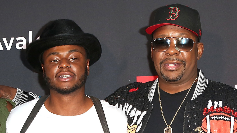 Bobby Brown Jr. and his father Bobby Brown posing on the red carpet
