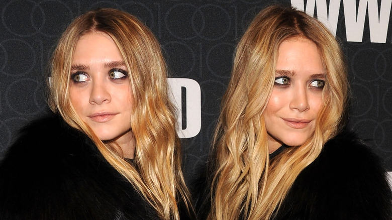 Mary-Kate and Ashley Olsen pose away from each other