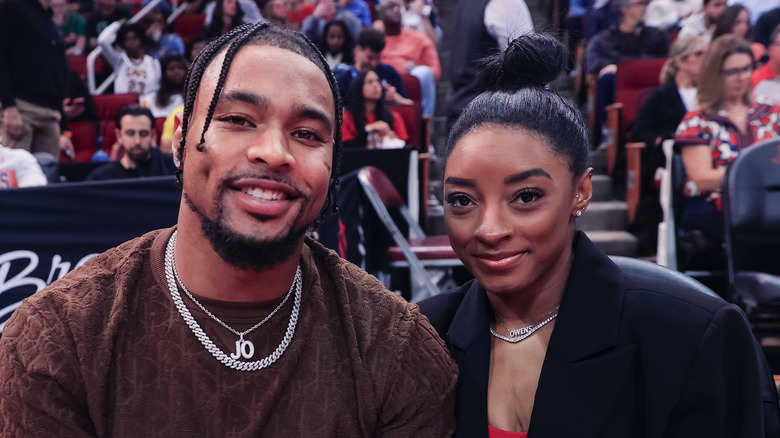 Jonathan Owens and Simone Biles at sporting event