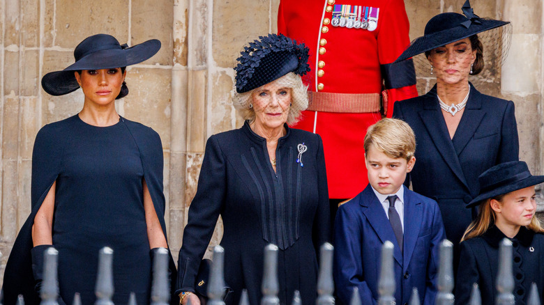 Camilla Parker Bowles with Meghan and Kate