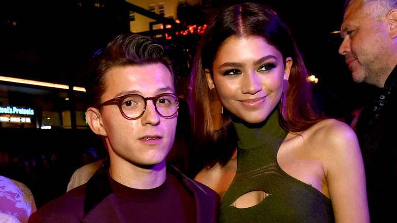 Tom Holland with his arm around Zendaya