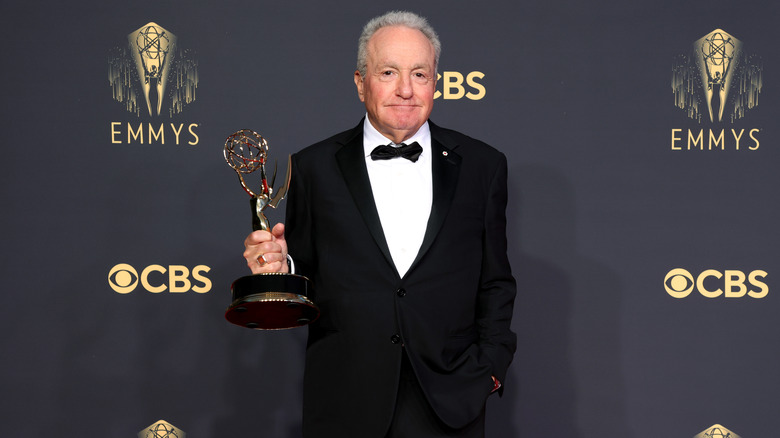 Lorne Michaels holding his Emmy award 