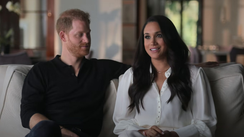 Prince Harry and Meghan Markle sitting