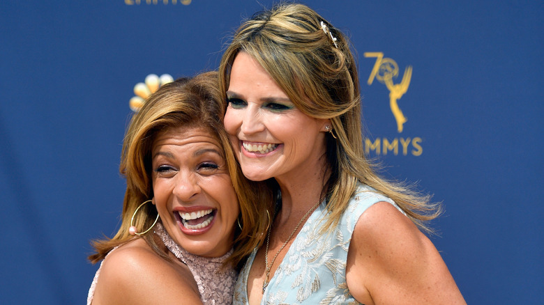 Hoda Kotb and Savannah Guthrie embracing 