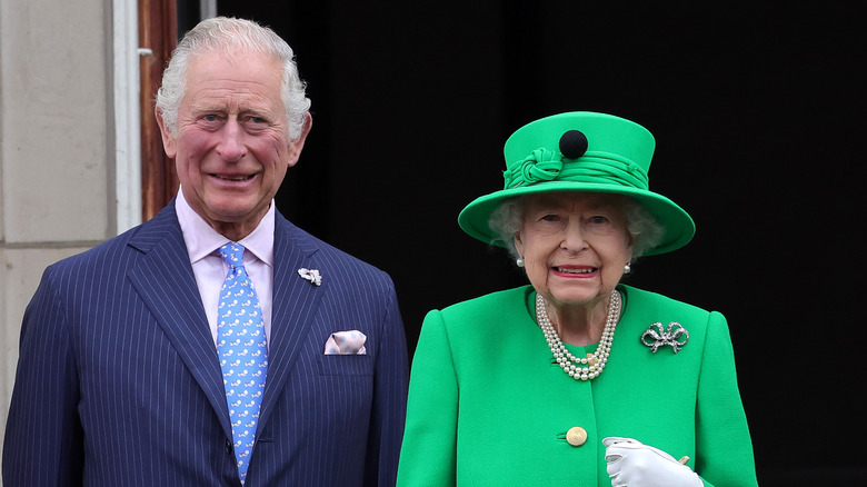 Prince Charles and Queen Elizabeth II in green outfit