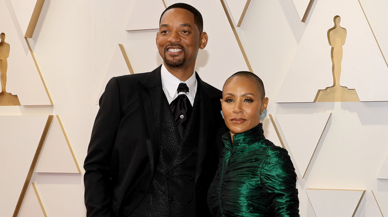 Will Smith and Jada Pinkett Smith posing at the Oscars