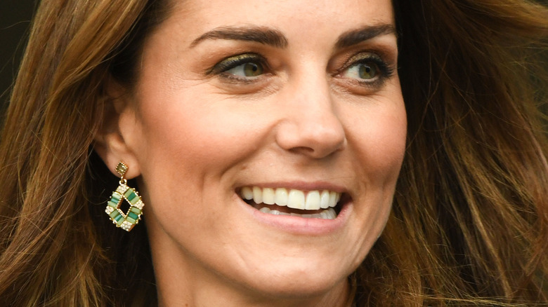 Kate Middleton smiles at a royal outing