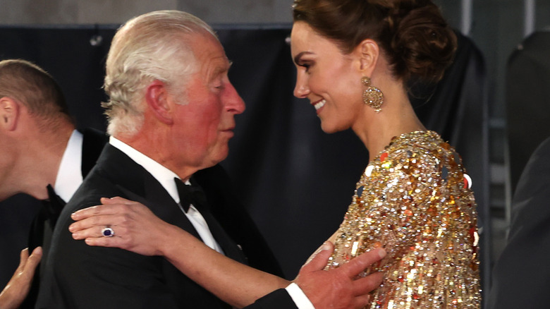 Prince Charles greets Kate Middleton at a premiere