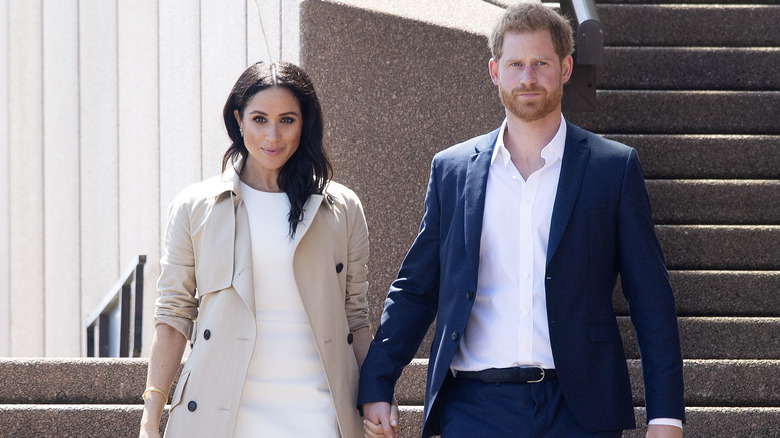 Prince Harry, Meghan Markle holding hands