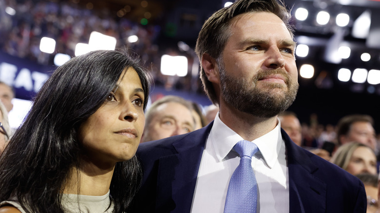 Usha Vance and J.D. Vance gazing in crowd