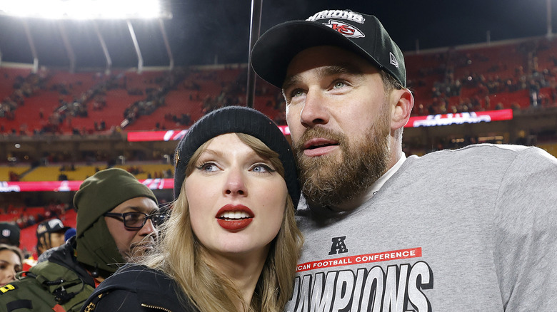 Taylor Swift hugging Travis Kelce