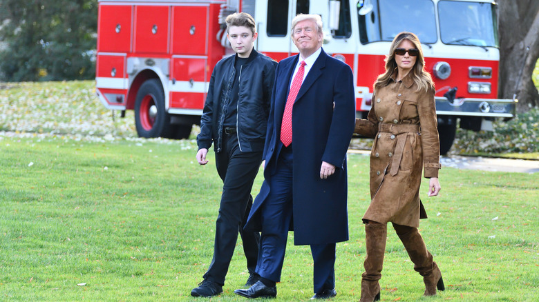 Barron Trump walking beside parents