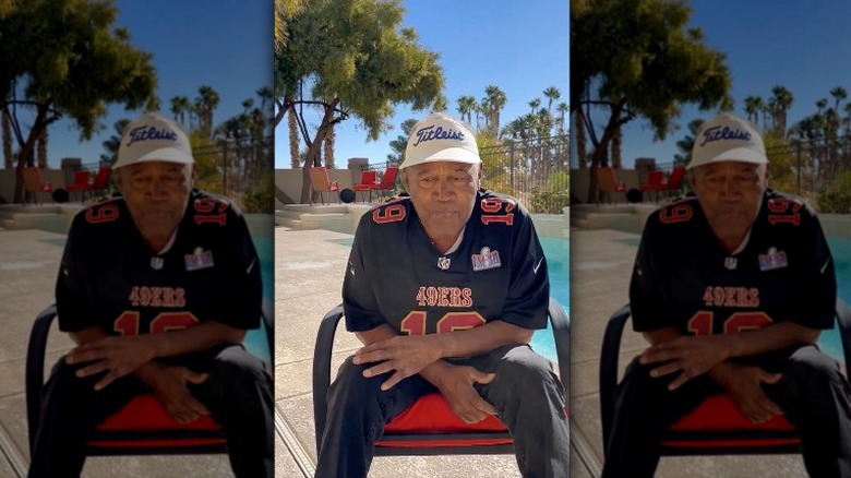 O.J. Simpson in a chair at pool