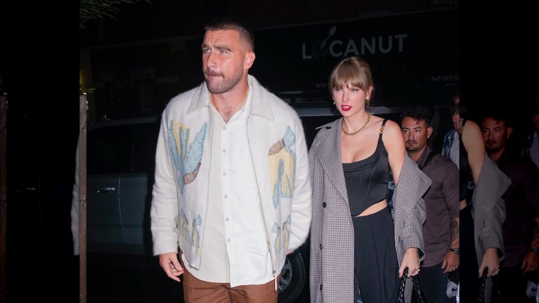 Travis Kelce and Taylor Swift walking