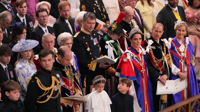 Prince Harry seated behind many others