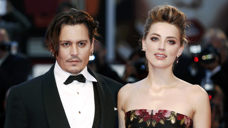 Amber Heard and Johnny Depp posing 