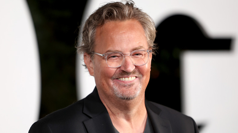 Matthew Perry smiling in close-up