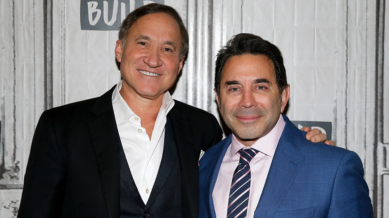 Dr. Terry Dubrow and Dr. Paul Nassir smiling