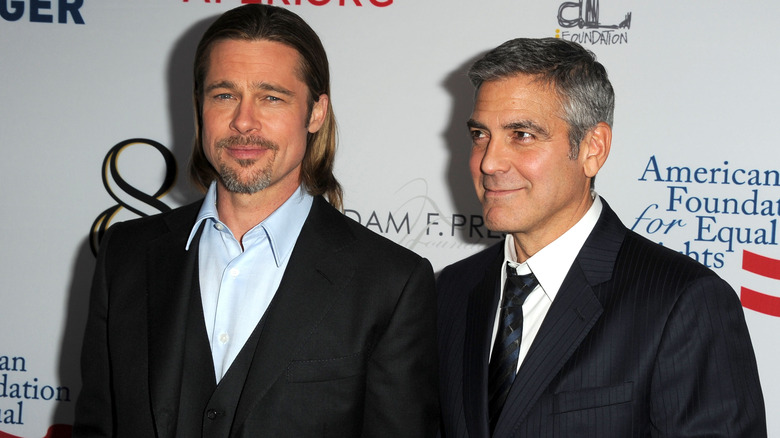 Brad Pitt and George Clooney smiling