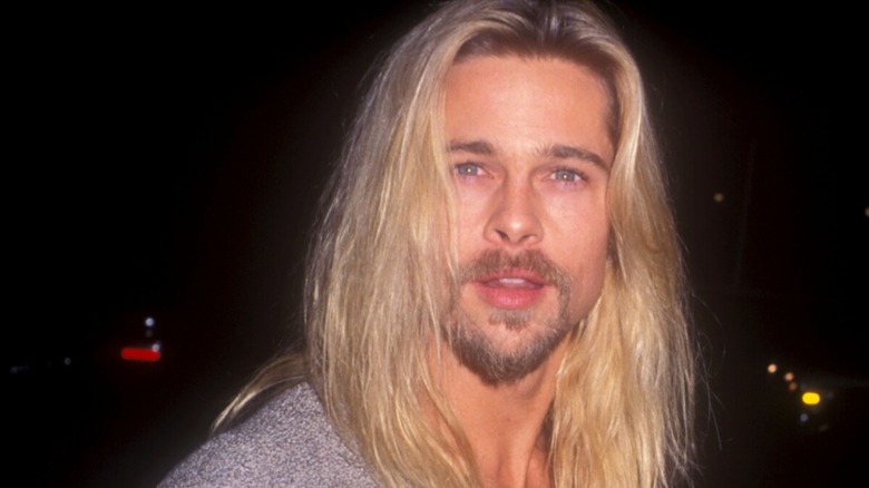 Brad Pitt with long bleached hair during Legends of the Fall premiere