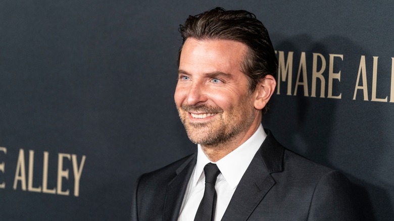 Bradley Cooper wears a suit at a 2021 event