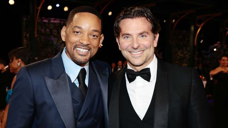 Will Smith and Bradley Cooper pose 