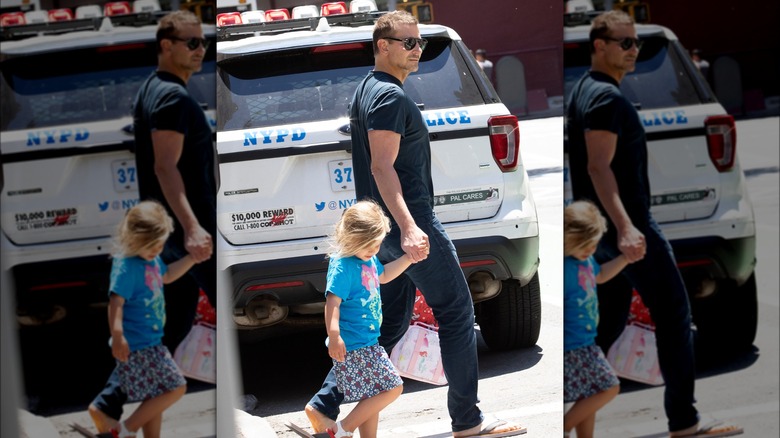 Bradley Cooper walking with daughter