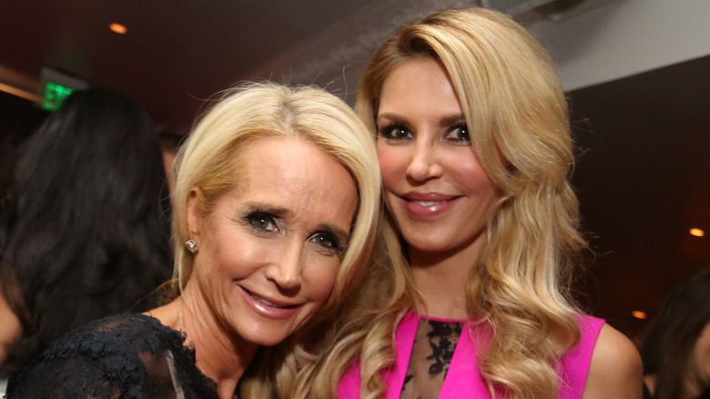 Kim Richards leaning on Brandi Glanville