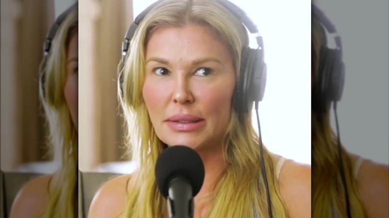 Brandi Glanville wearing headphones