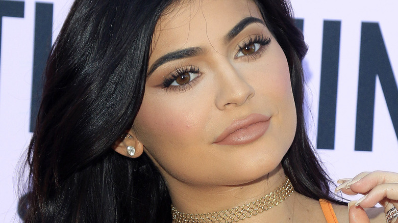 Kylie Jenner diamond earrings gold neck collar