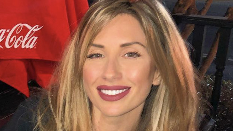 Ashley Jacobs smiling on a bar patio