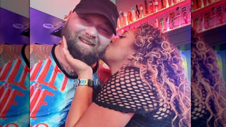 Bray Wyatt and Jojo Offerman embracing 