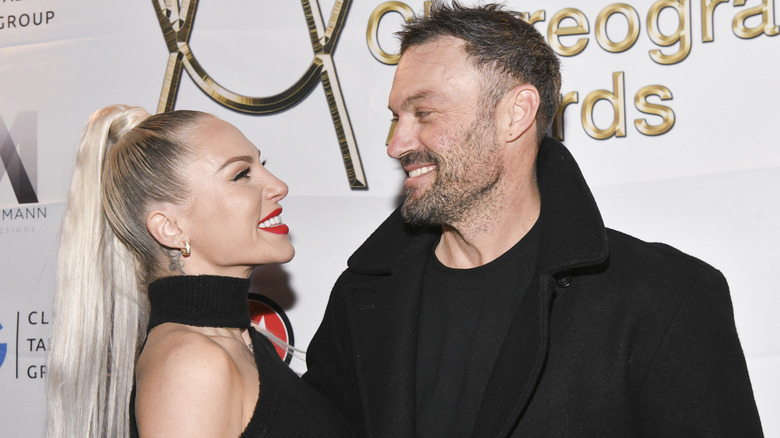 Brian Austin Green and Sharna Burgess pose 